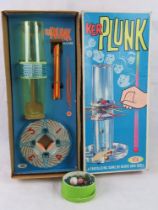 A vintage Kerplunk game in box, associated marbles.