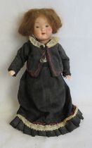 An antique doll bearing mark to back of head Trebor Germany, 20cm high.