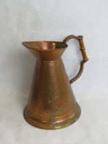 A copper water jug.
