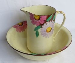 A large Myott Son & Co wash jug and bowl in yellow ground with floral pattern upon.
