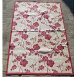 A red floral pattern Laura Ashley rug measuring approx 158 x 230cm.