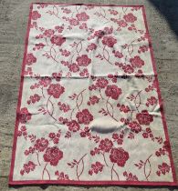 A red floral pattern Laura Ashley rug measuring approx 158 x 230cm.