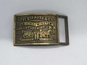 A c1970s Levi Strauss & Co USA belt buckle, R mark to back.