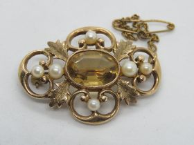 A 9ct gold brooch set with large central oval cut citrine and pearls in foliate setting,