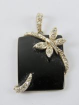 A silver and onyx pendant of rectangular form having butterfly design upon, stamped 925, 3.