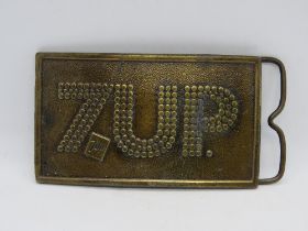 A c1970s 7Up bottle opener belt buckle made by Bergamot Brass Works Wisconsin USA.