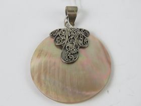 A silver and mother of pearl pendant, stamped 925, 3.5cm dia.