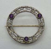 A delightful amethyst set wreath brooch stamped 14k, 22mm dia, 2g.