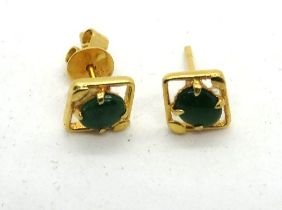 A pair of jade stud earrings, one butterfly back stamped 750, 1.1g.