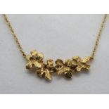 A 9ct gold floral panel necklace, hallmarked 375, 1.9g.