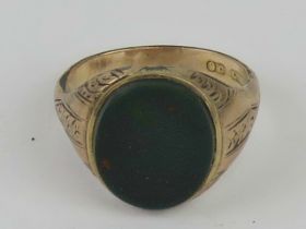 A late Victorian early Edwardian 9ct rose gold signet ring having bloodstone uncarved seal,