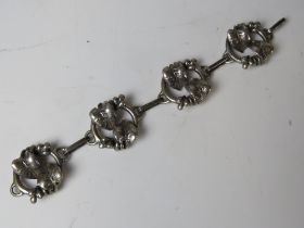 An 800 silver arts and crafts style four panel articulated bracelet having ivy leaf design to each