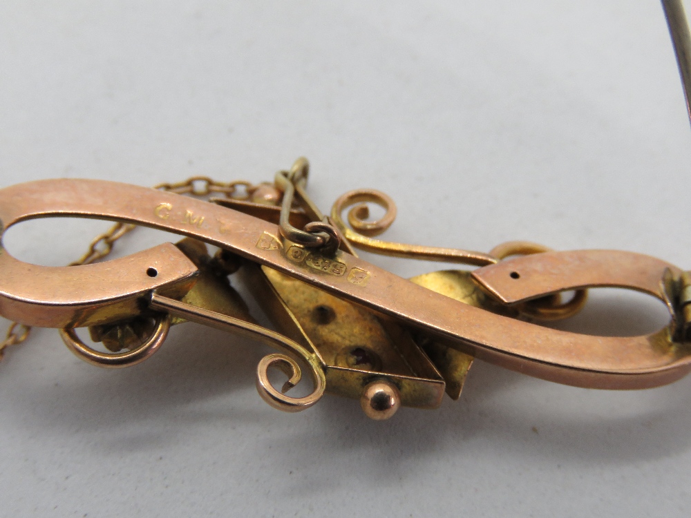 A 9ct rose gold brooch set with rubies and diamond, hallmarked for Chester, 3.5g. - Image 2 of 2