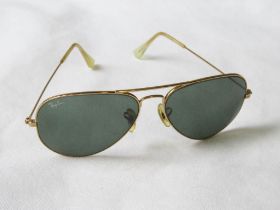 Rayban - a pair of vintage gold tone classic aviator sunglasses with grey lenses and branded case.