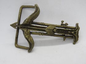 A crossbow themed belt buckle c1975 marked with I through H and War Hyden to back.