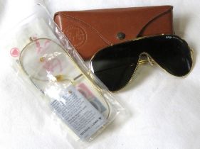 Rayban - a pair of vintage gold tone Wings sunglasses with black lenses and branded case.