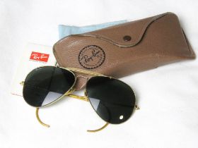 Rayban - a pair of vintage gold tone classic Aviator sunglasses with grey lenses and branded case.