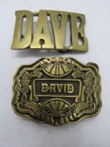Two belt buckles, Dave and David.