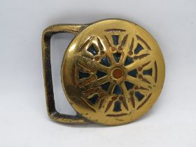 A rare Tech-Ether Guild brass belt buckle 'Wheel of Law'.
