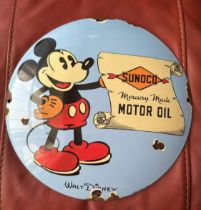 A contemporary 'distressed' enamelled advertising roundel for Sunuco Motor Oil featuring Walt