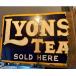 A vintage double-sided enamelled advertising sign for Lyons Tea, wall mounted,