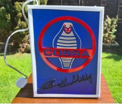 A contemporary illuminated AC Cobra box sign, 42 x 32 x 10cm.