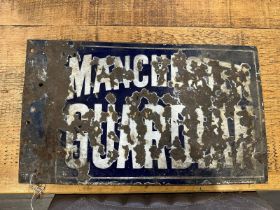 A vintage enamelled double sided advertising sign for Manchester Guardian,