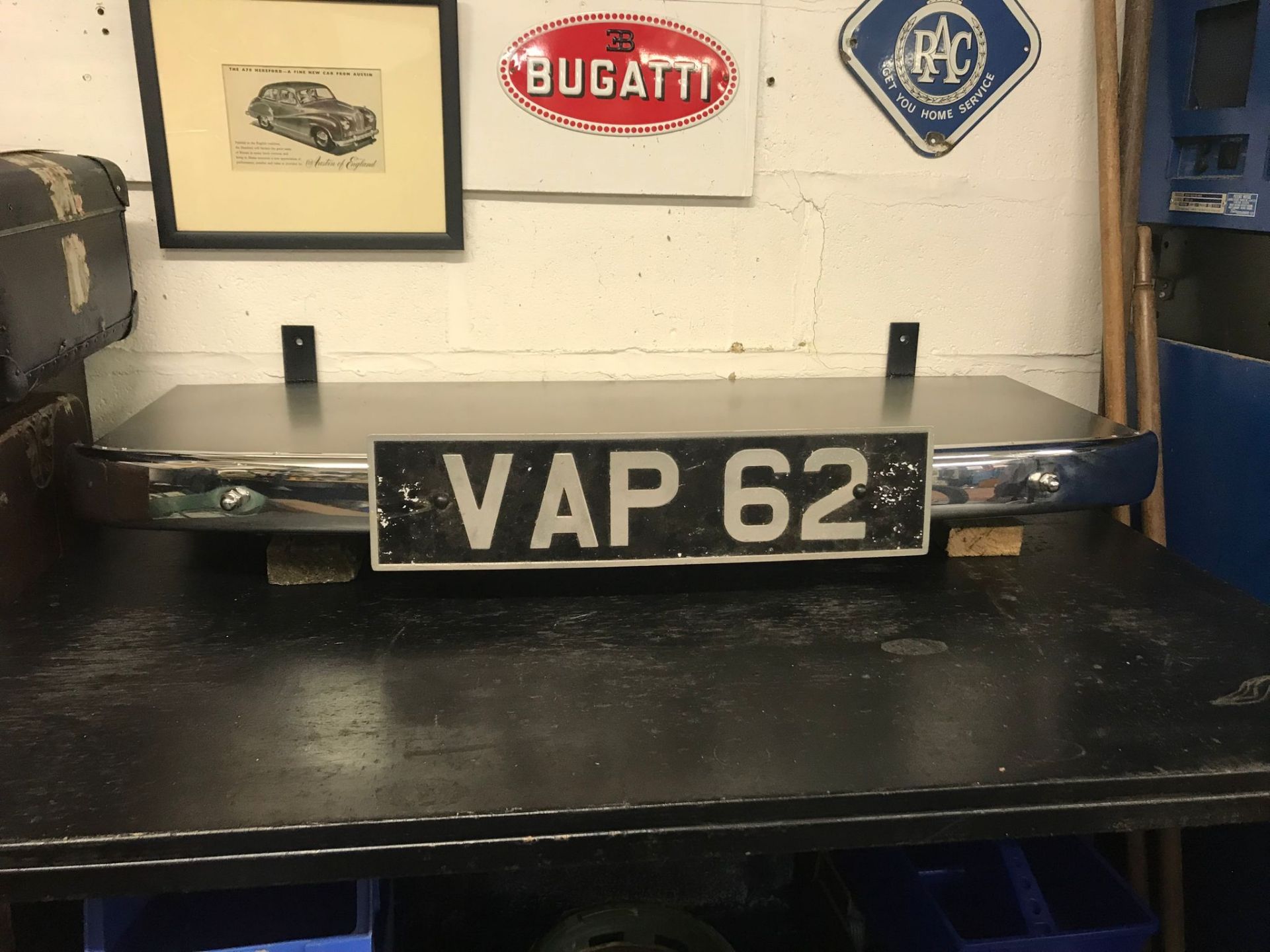 A superb man-cave shelf formed from a vintage chrome bumper and plate.