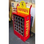 A superb automotive wine rack in Ferrari colours formed from an original Castrol Oil mobile rack.