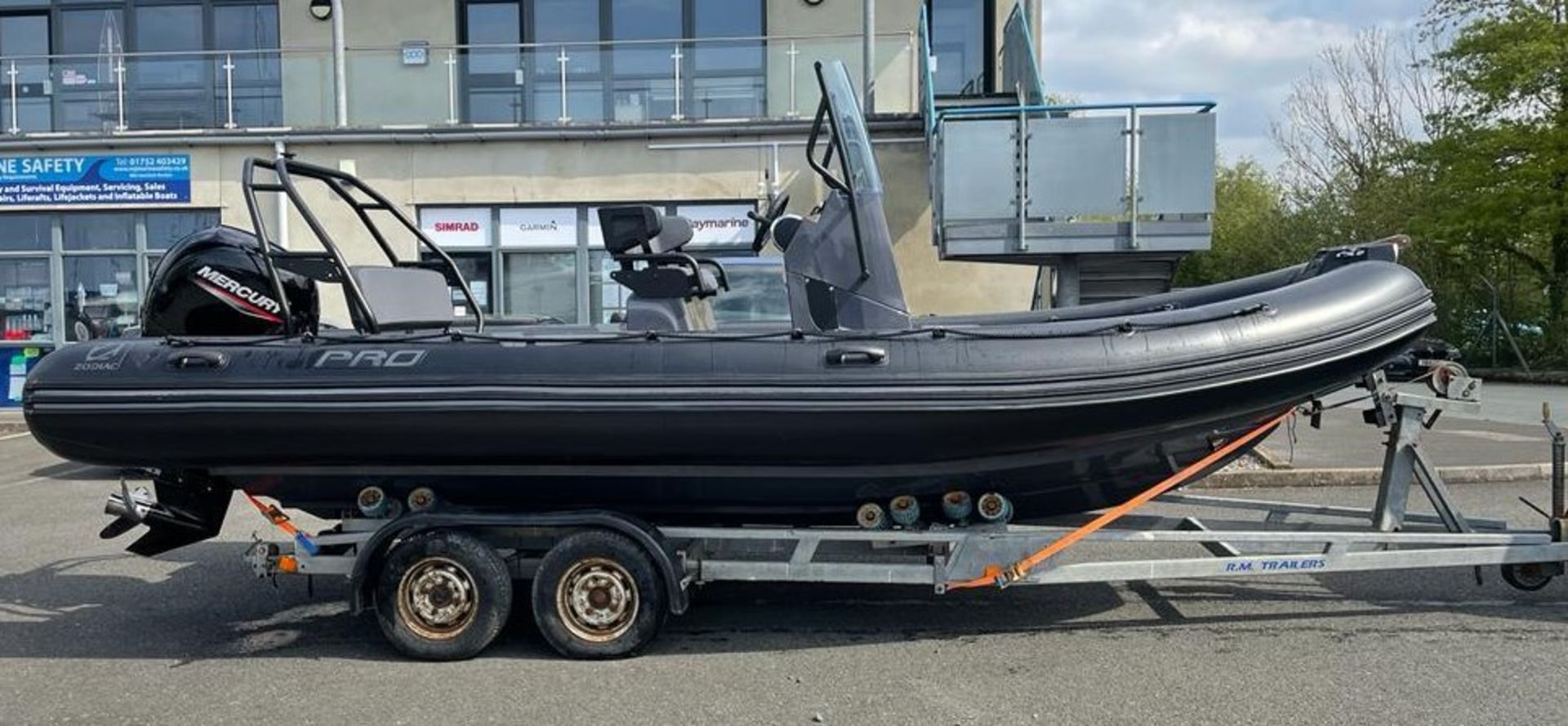 Zodiac 650 Pro rigid inflatable boat with Mercury 150 outboard engine. Includes road trailer.