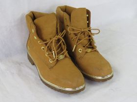 A pair of ladies size 6 Timberland boots.