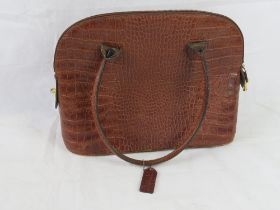 A vintage leather 'crocodile skin' handbag.