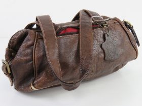 A brown leather handbag by Smith & Conova approx 30cm wide.