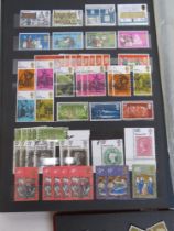 A quantity of assorted 20thC stamps within two albums.