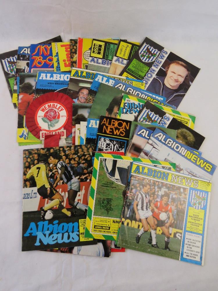 A quantity of West Bromwich Albion 'Albion News' magazines together with a Wembley 1979 rosette.