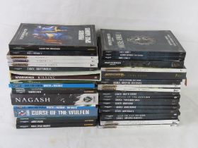 A large collection of Warhammer books including Warhammer 40,000 and Age of Sigmar.