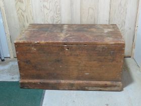 An antique pine blanket box.