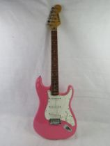 A Westfield electric guitar in pink.