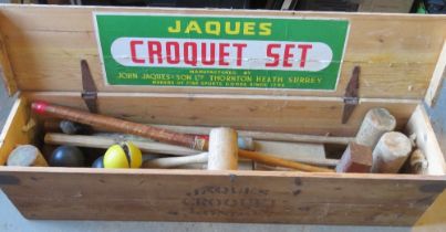 A Jaques croquet set including four matching mallets (one handle deficient), post, spare mallets,