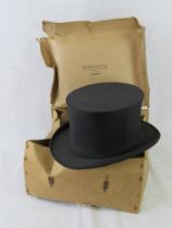 A collapsible top hat by Dunn & Co in original box, box a/f.