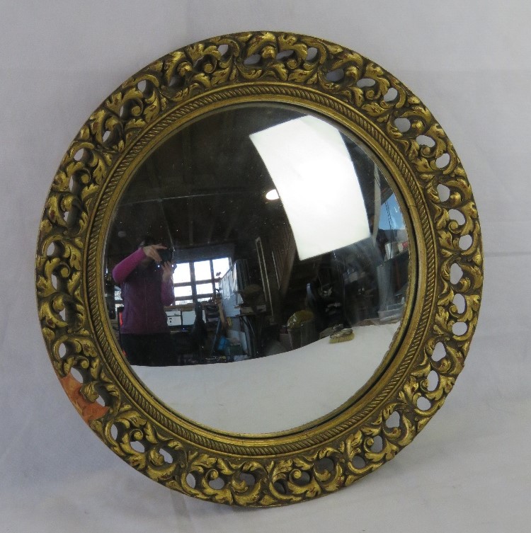 A round convex wall mirror, wooden and composite frame slightly a/f.