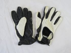 A pair of mens part leather driving gloves.