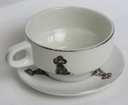 A delightful duck and Poodle type dog themed teacup and saucer, cartoon style images,