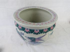An Oriental style ceramic planter.