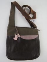 Radley; a brown cross body bag having pink dog key chain upon, approx 25cm wide.