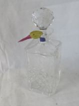 A Thomas Webb crystal decanter with original label.