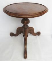 A mahogany wine table raised over carded base with three outswept legs, approx 47cm high x 46cm dia.