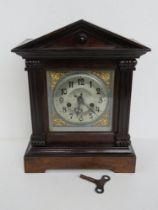 A JB Yabsley London mantle clock in good architectural frame opening to reveal pendulum and key