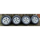 A set of Ferrari 180 TR 390 Speedline alloy wheels each fitted with 240/44/VR390 Michelin tyres.