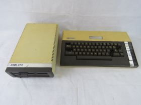 An Atari 1050 and an Atari 800XL computer.